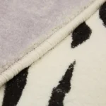 Tapis Peau de Vache, textile naturel pour ambiance rustique
